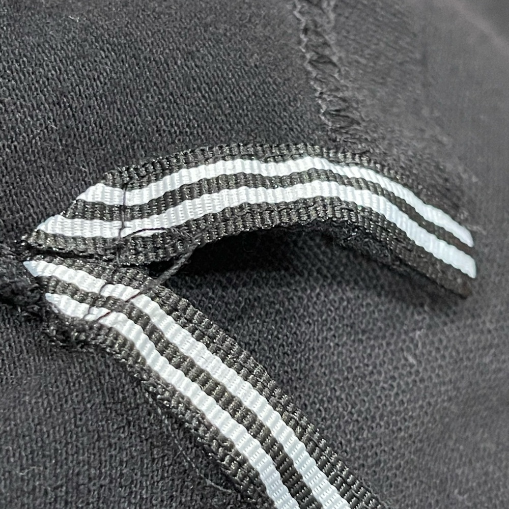 Stylish Black Polo Shirt with White Accents - Picture 9 of 10